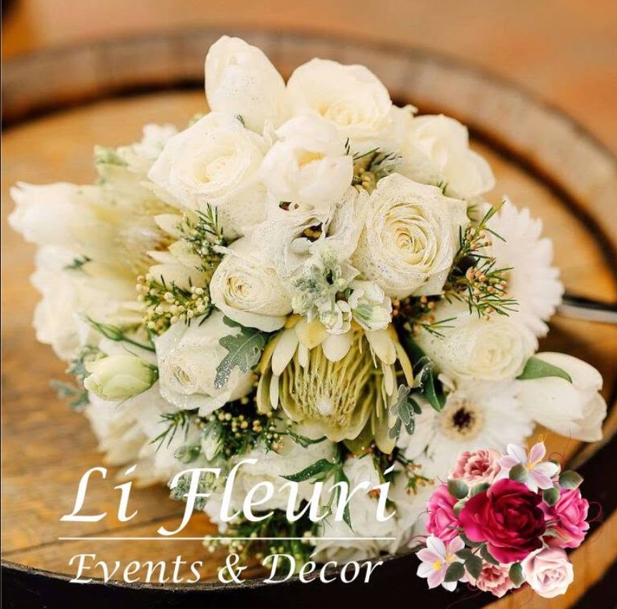 White rose bridal bouquet with soft cream blooms and greenery